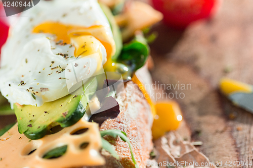 Image of The baguette and cheese on wooden background