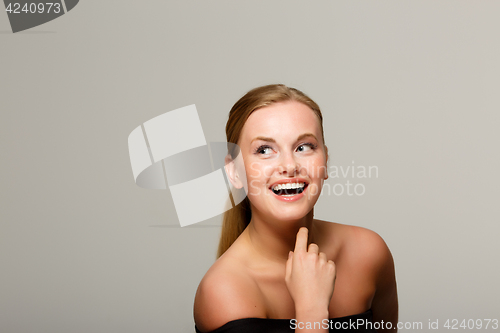 Image of Smiling woman with bare shoulders