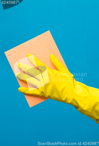 Image of Man wiping window with rag