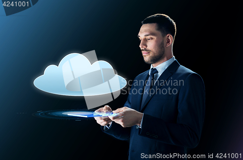 Image of businessman with tablet pc and cloud projection