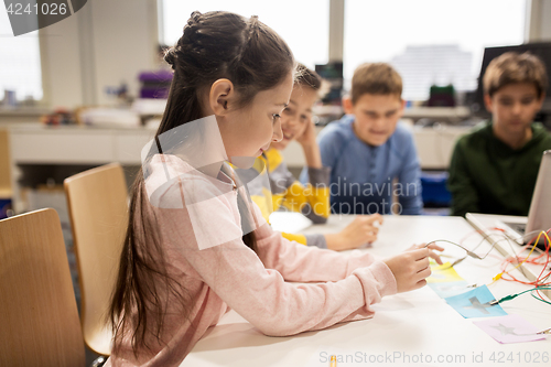 Image of happy kids with invention kit at robotics school