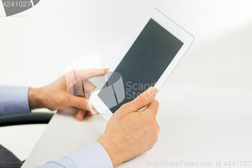 Image of businessman hands with tablet pc at office