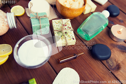 Image of close up of body care cosmetic products on wood