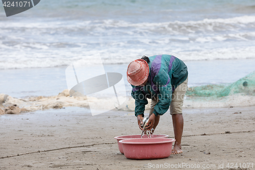 Image of Native Malagasy fishermen fishing on sea, Madagascar