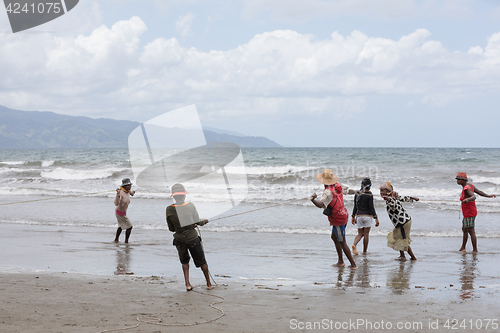 Image of Native Malagasy fishermen fishing on sea, Madagascar