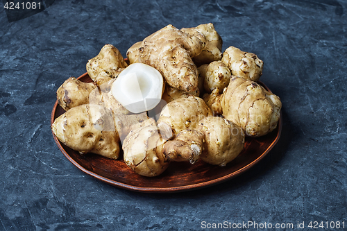 Image of Jerusalem artichokes on dark background