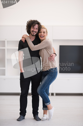 Image of couple hugging in their new home