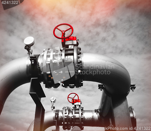 Image of Industrial zone, Steel pipelines and valves against blue sky