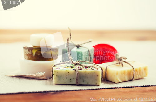 Image of close up of handmade soap bars on wood