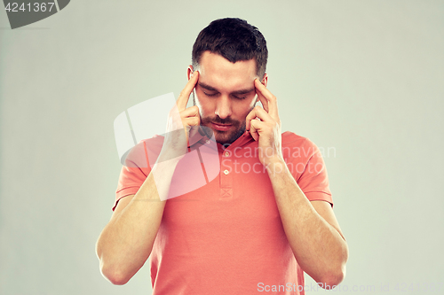 Image of man suffering from head ache or thinking