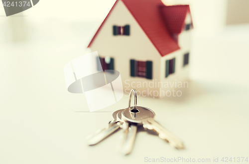 Image of close up of home model and house keys