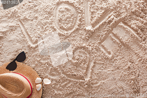 Image of Love written in a sandy tropical beach