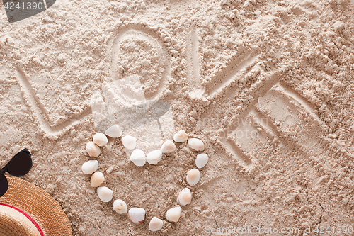 Image of Love written in a sandy tropical beach