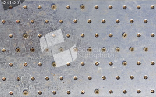 Image of Texture of the metal plate with bolts and holes