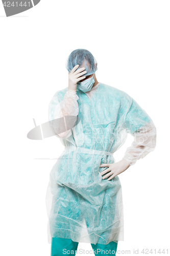 Image of Surgeon portrait. covered face with his hands. sad. isolated on white background