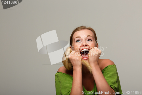 Image of Cheerful woman in green dress