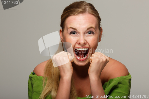 Image of Screaming girl in green dress