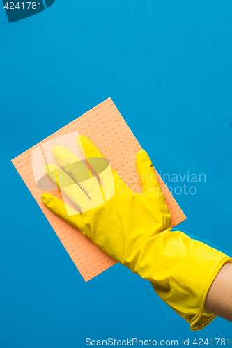 Image of Hand with rag wipes window