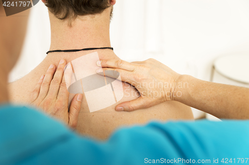 Image of young man at the physio therapy with pain