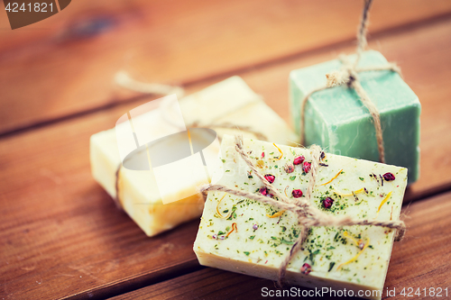 Image of close up of handmade soap bars on wood