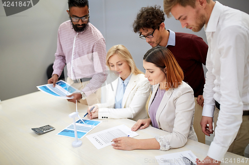 Image of business people discussing green energy project