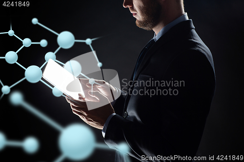 Image of close up of businessman with transparent tablet pc