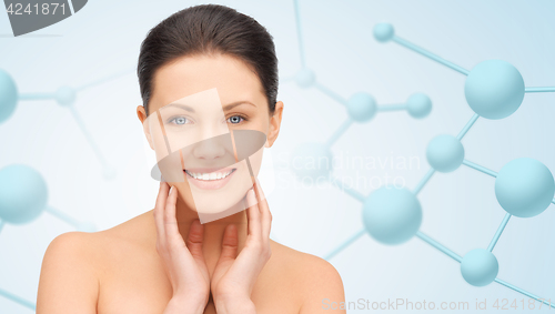 Image of beautiful young woman face with molecules