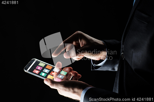 Image of close up of businessman hand with glass smartphone