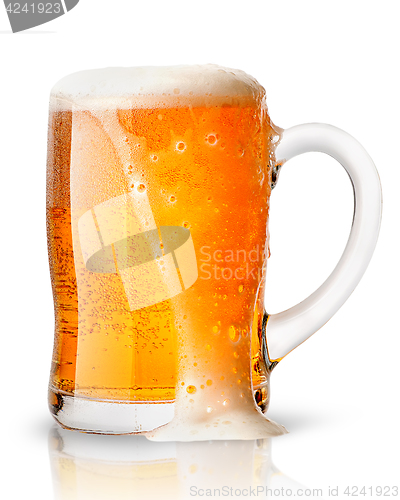 Image of Light beer with foam in mug