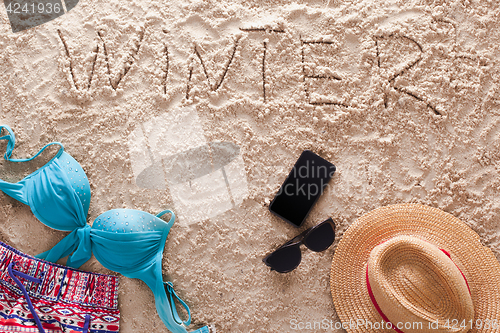 Image of Winter written in a sandy tropical beach