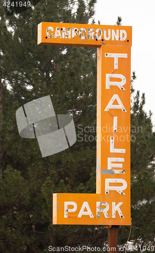 Image of Campground Trailer Park Sign Advertising in Disrepair