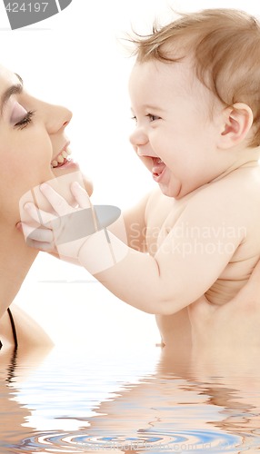 Image of happy cuddle with mother