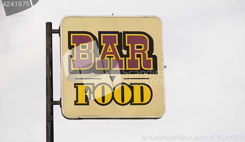 Image of Rusted Metal Faded Sign Advertising Bar Food