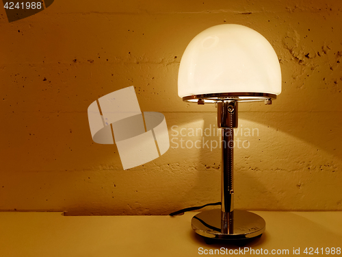 Image of Table lamp giving warm orange light