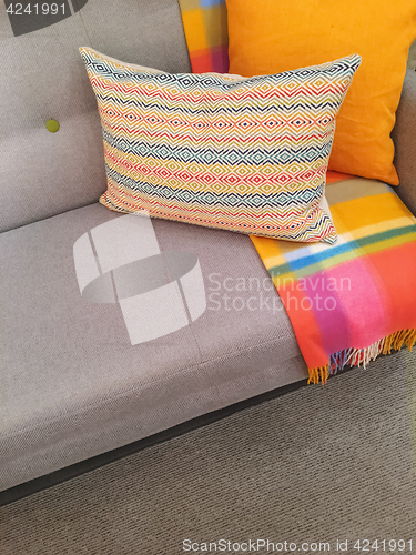 Image of Sofa and cushions in gray and orange tones