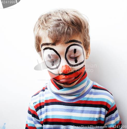 Image of little cute boy with facepaint like clown, pantomimic expression