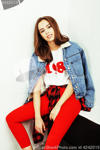 Image of young pretty teenage hipster girl posing emotional happy smiling on white background, lifestyle people concept closeup