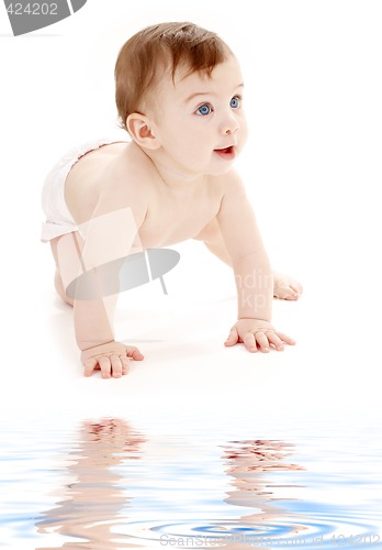 Image of crawling baby boy looking up