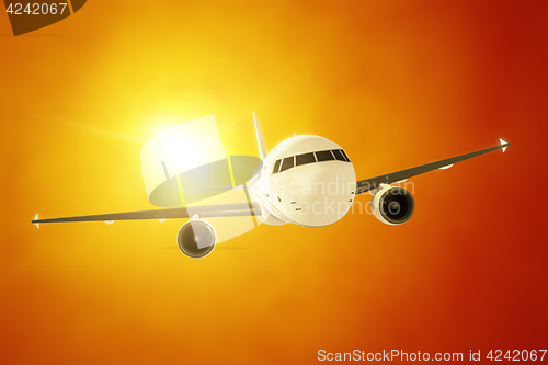 Image of passenger airplane in the evening sun