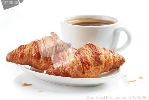 Image of fresh croissants and coffee cup