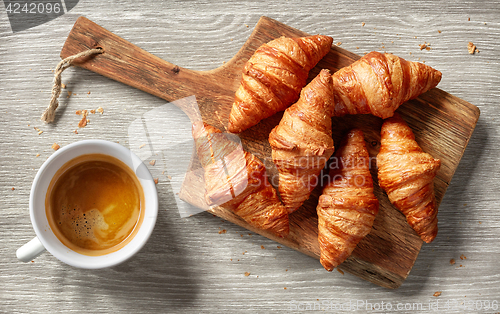 Image of freshly baked croissants and coffee cup
