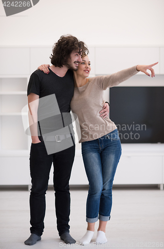 Image of couple hugging in their new home