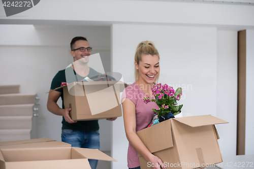 Image of young couple moving into a new home