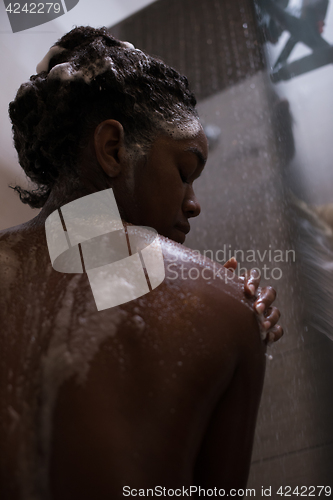 Image of African American woman in the shower