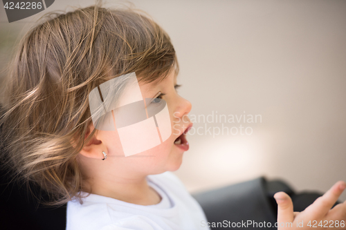 Image of baby girl sitting in the pram