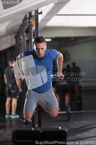 Image of man doing exercises parallel bars