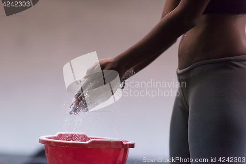 Image of black woman preparing for climbing workout