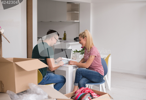 Image of Young couple moving in a new home