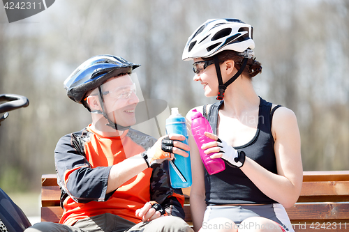 Image of Bicycles with water on bench