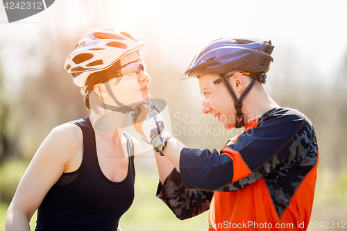 Image of Bicyclists in helmets at park